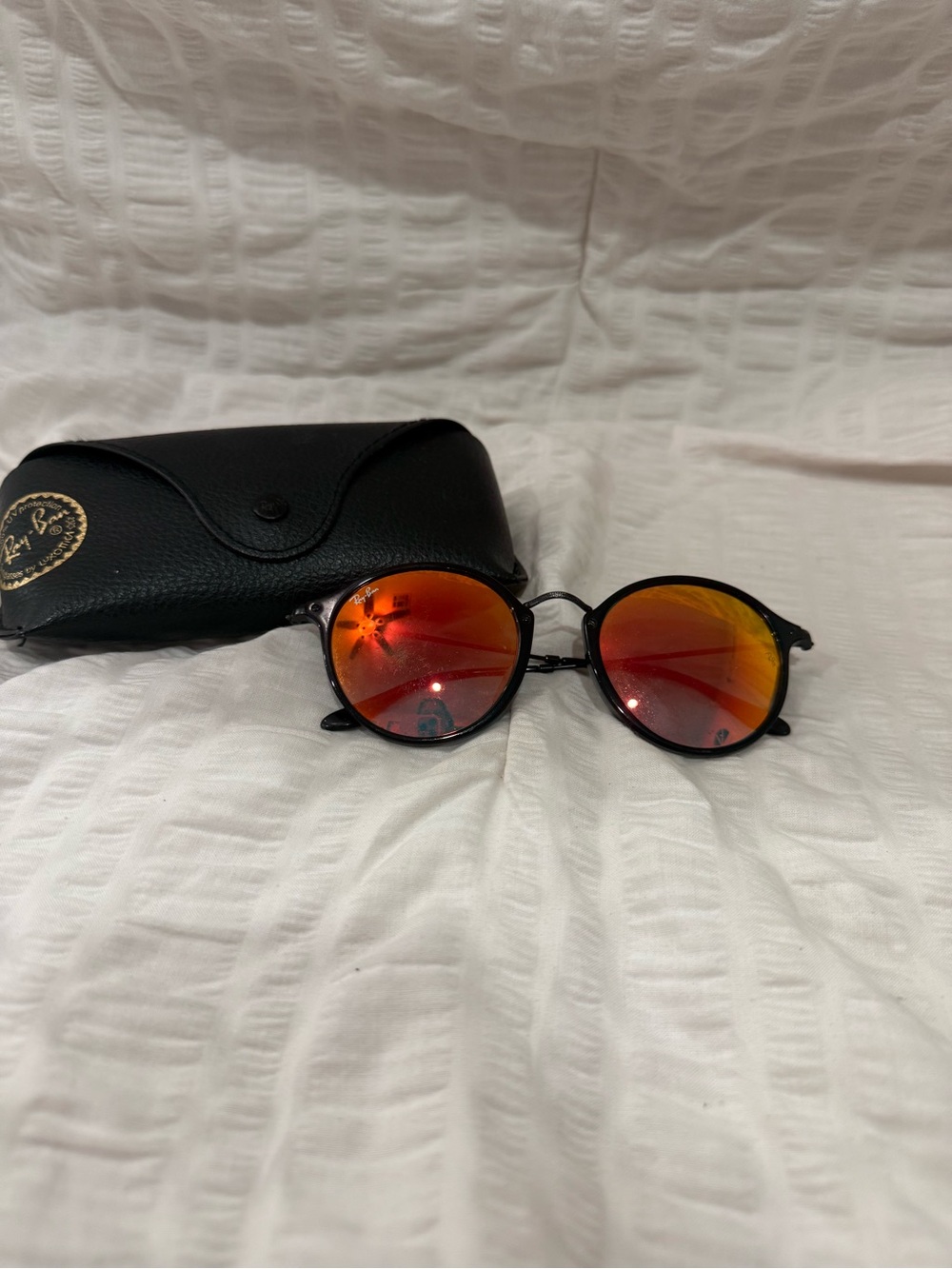Ray-Ban Black Frame Sunglasses with Red-Orange Mirrored Lenses